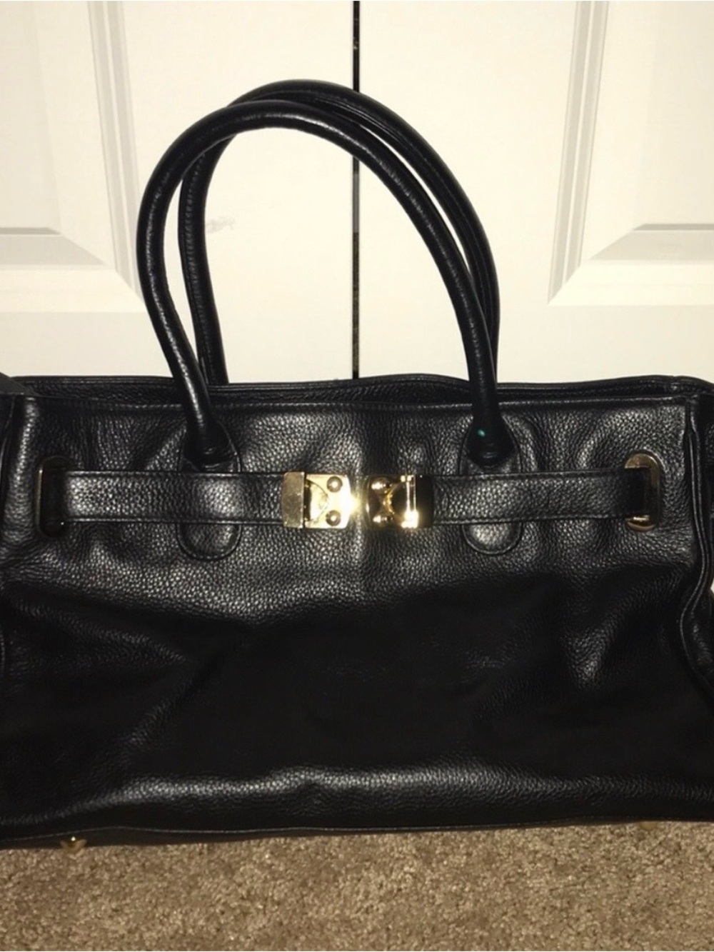 Black leather Onna Ehrlich handbag.